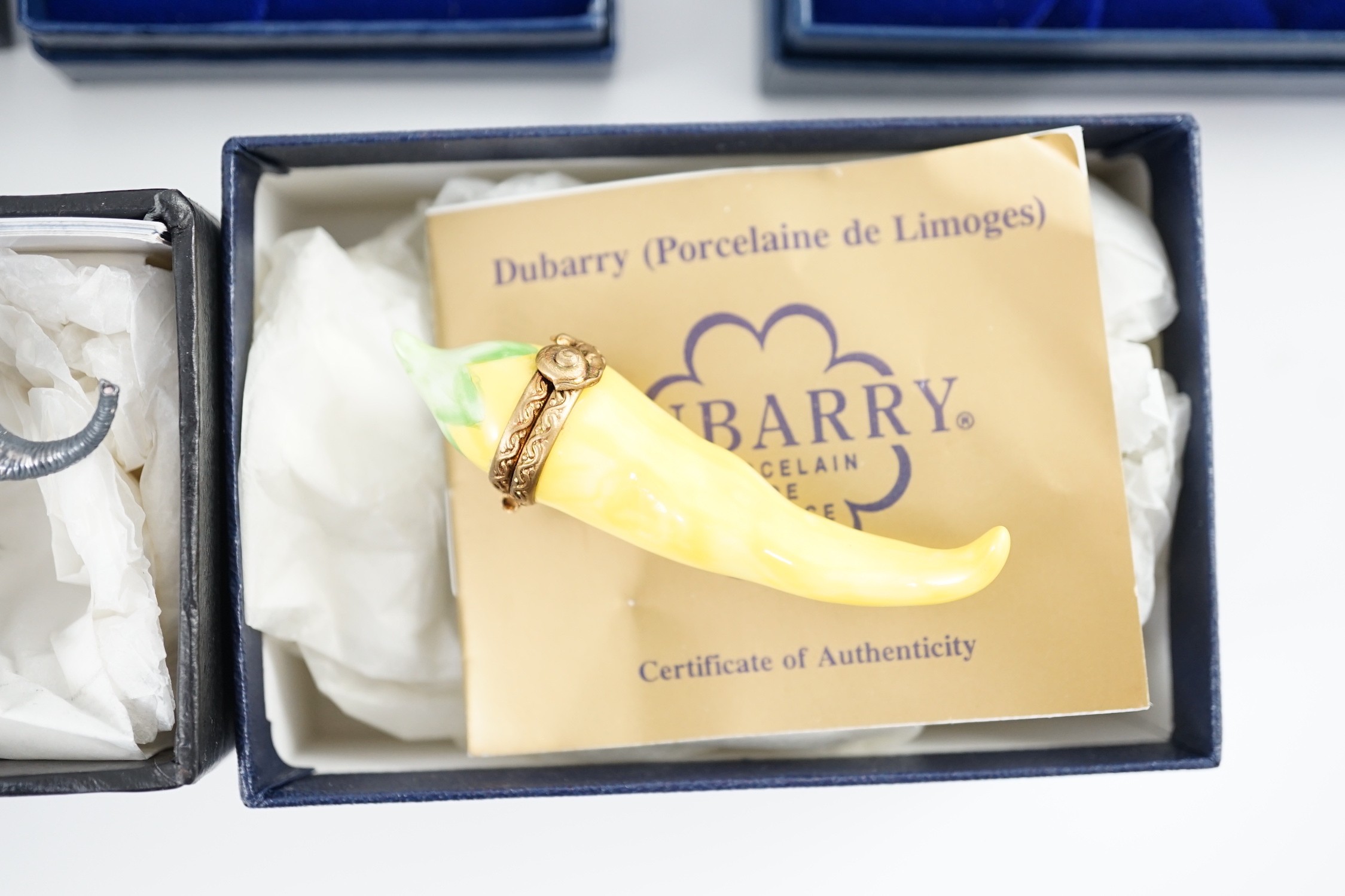 Two Halcyon Days enamel boxes; frog and 1991, two Dubarry boxes and a white metal model elephant, all boxed.